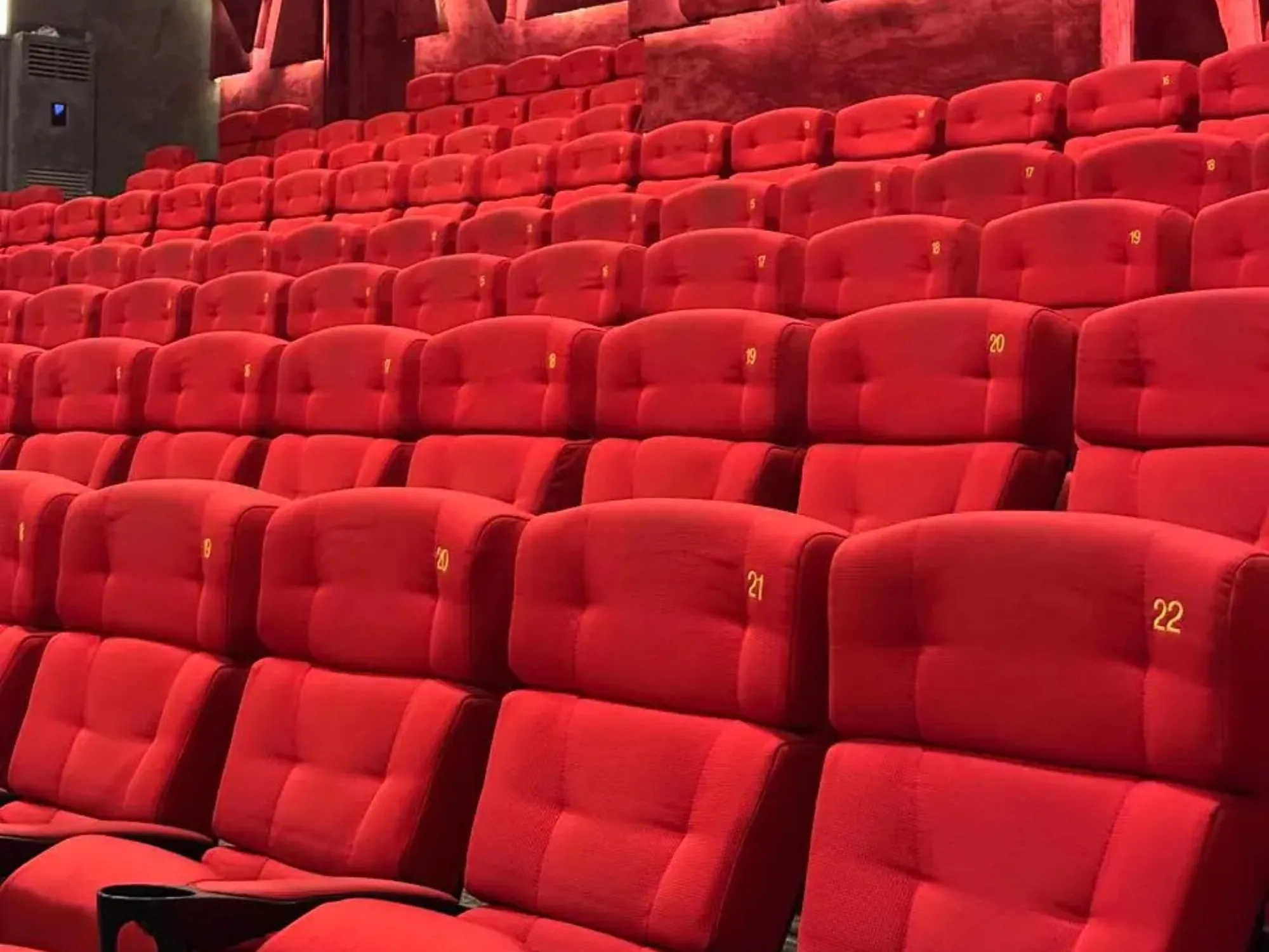 Rows of red CineStar seats seen from the front of the auditorium