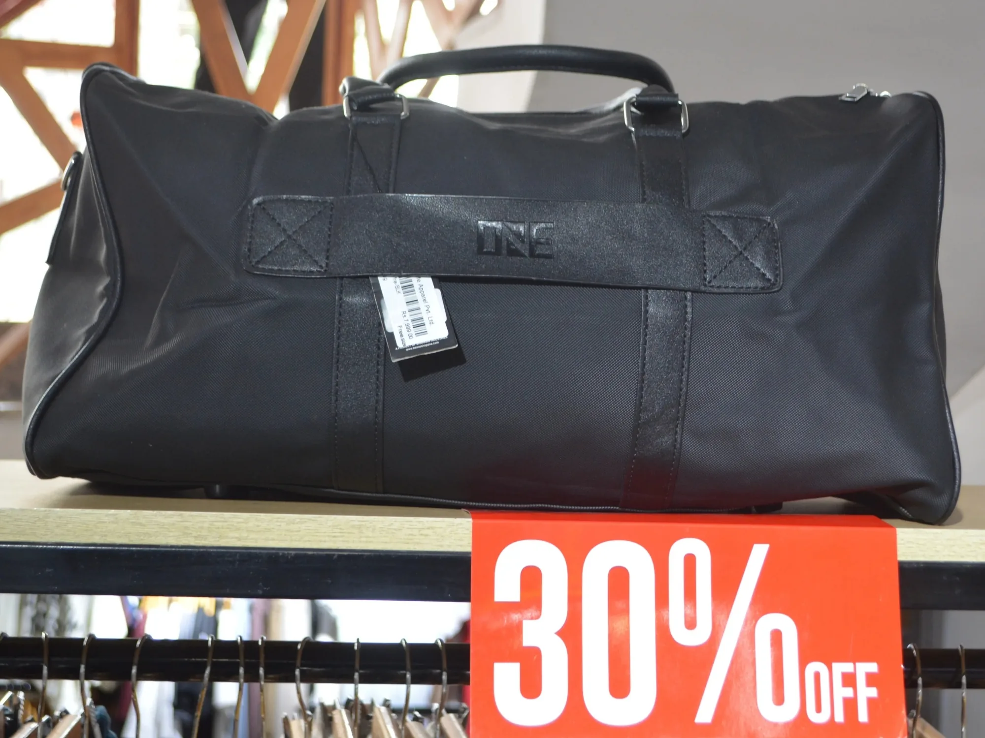 A leather holdall on display at ONE with a thirty per cent off card