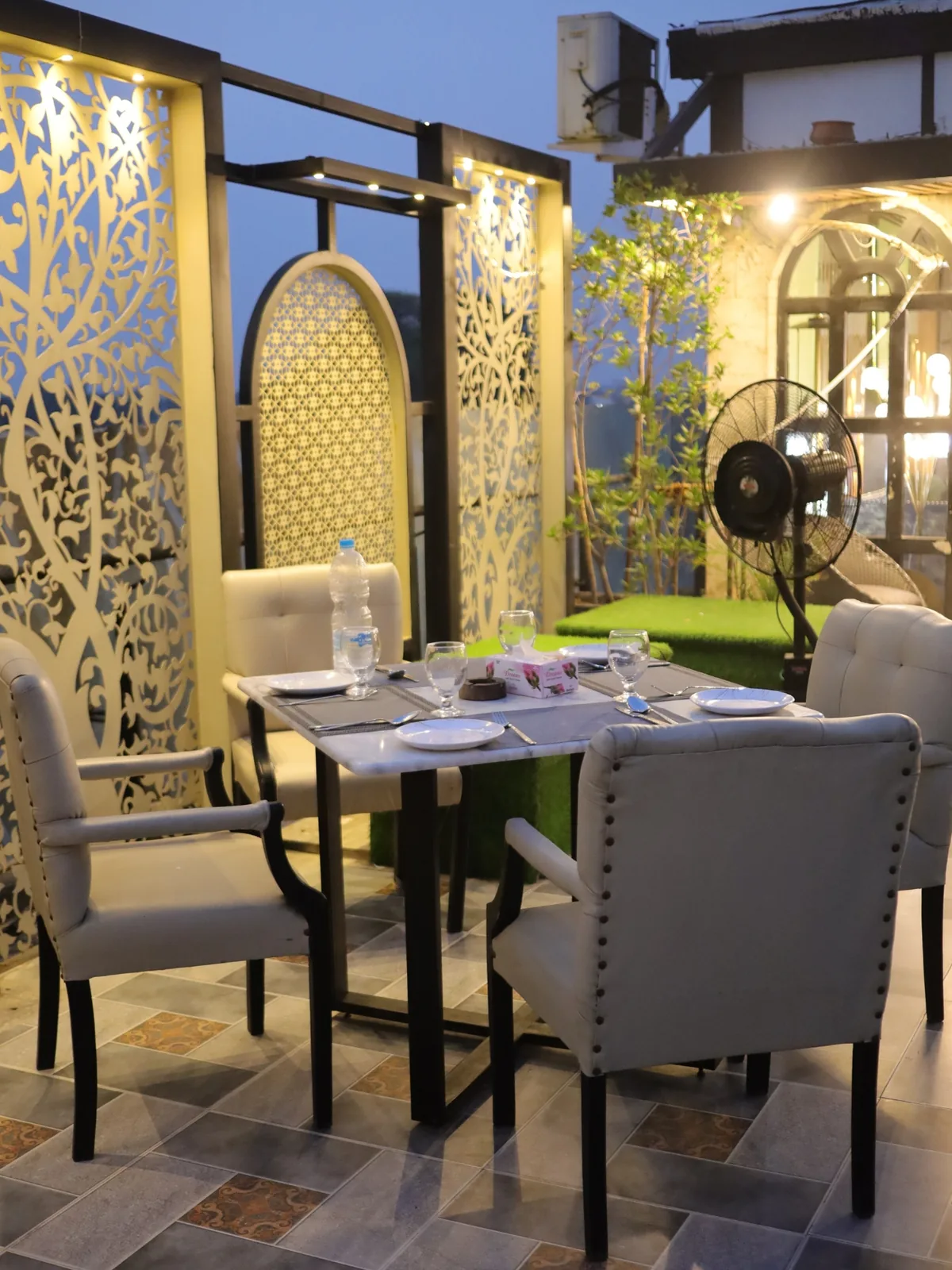 Laid tables on the Aangan rooftop terrace at Xin Mall