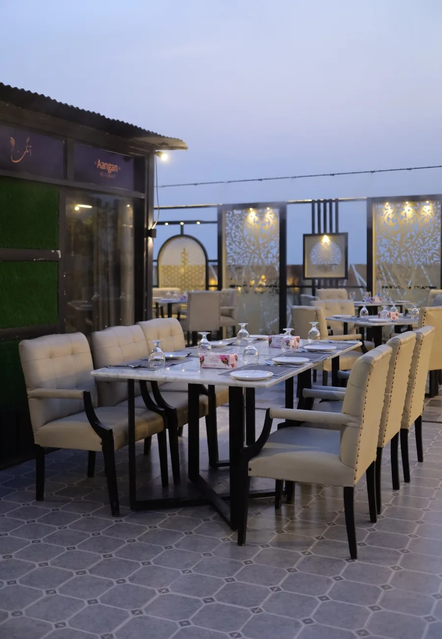 Tables laid on the Aangan rooftop terrace