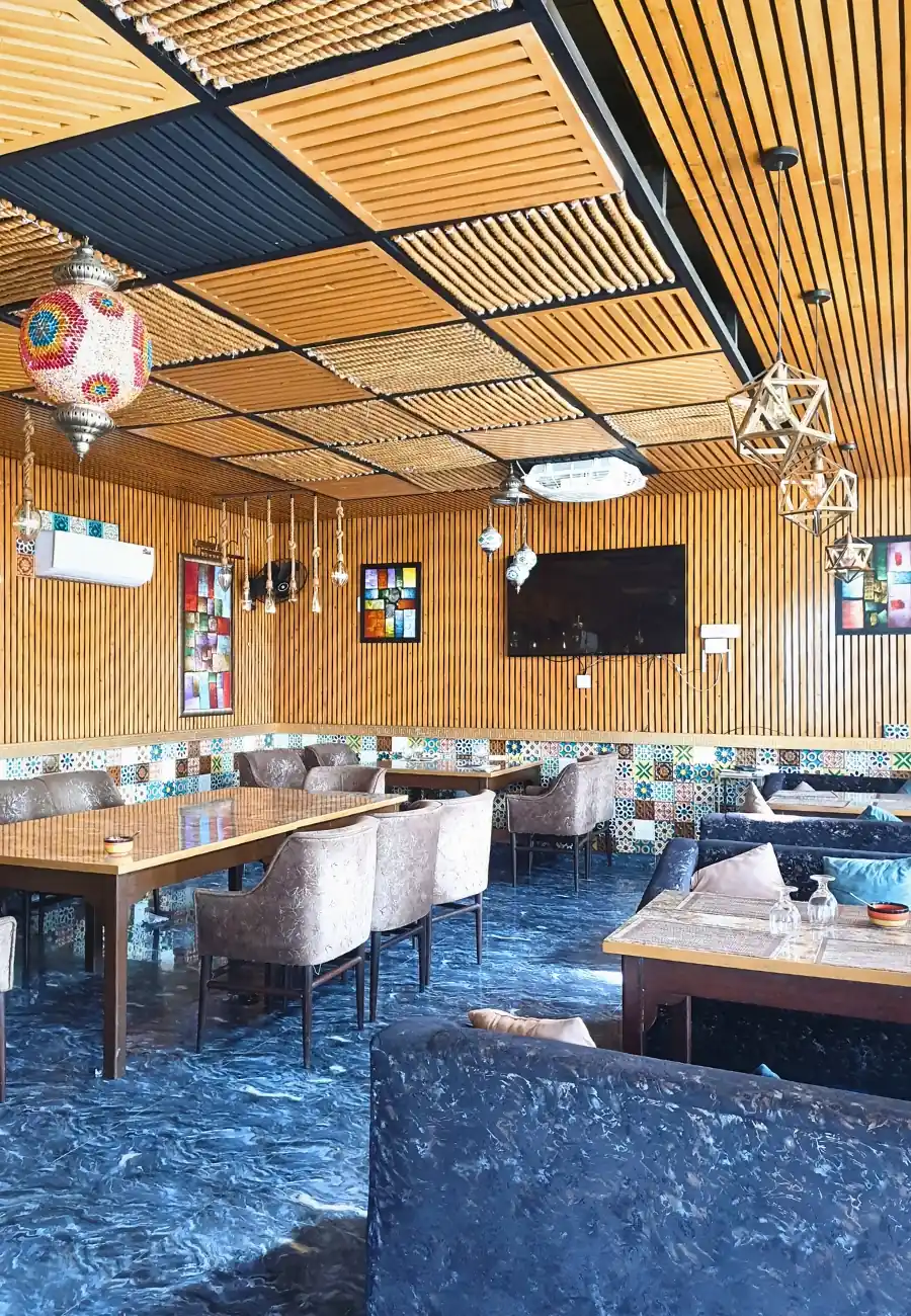 The wood-panelled dining room at Aangan