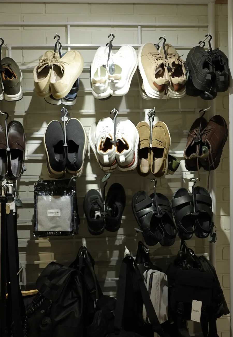 A wall of footwear and bags at BREAKOUT