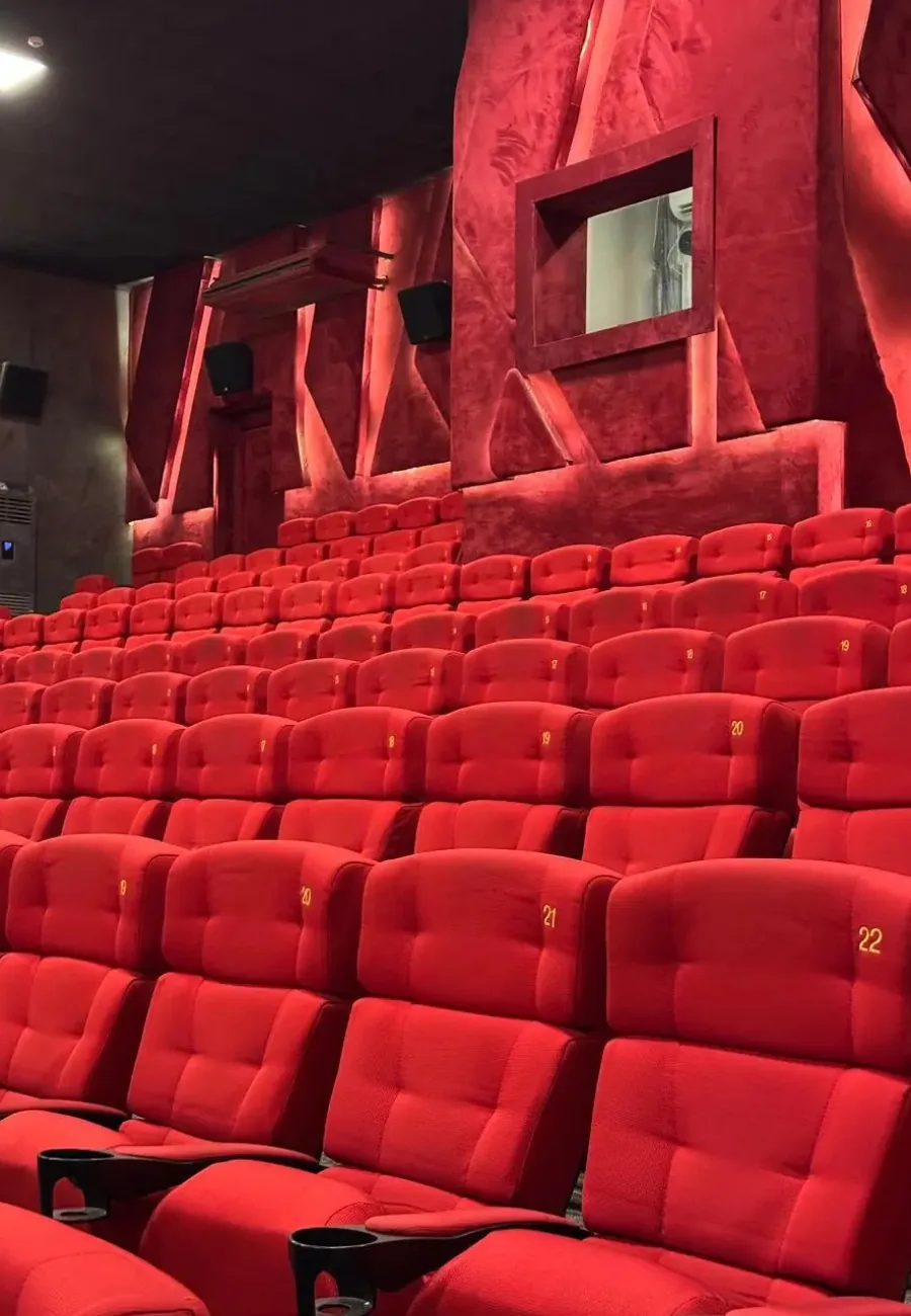 Rows of red seats in a CineStar auditorium