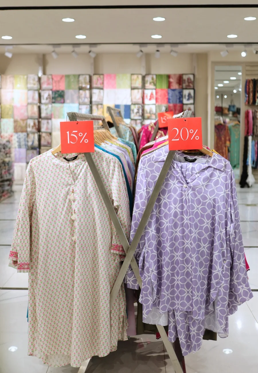 Printed suits on stands at Limelight, marked down