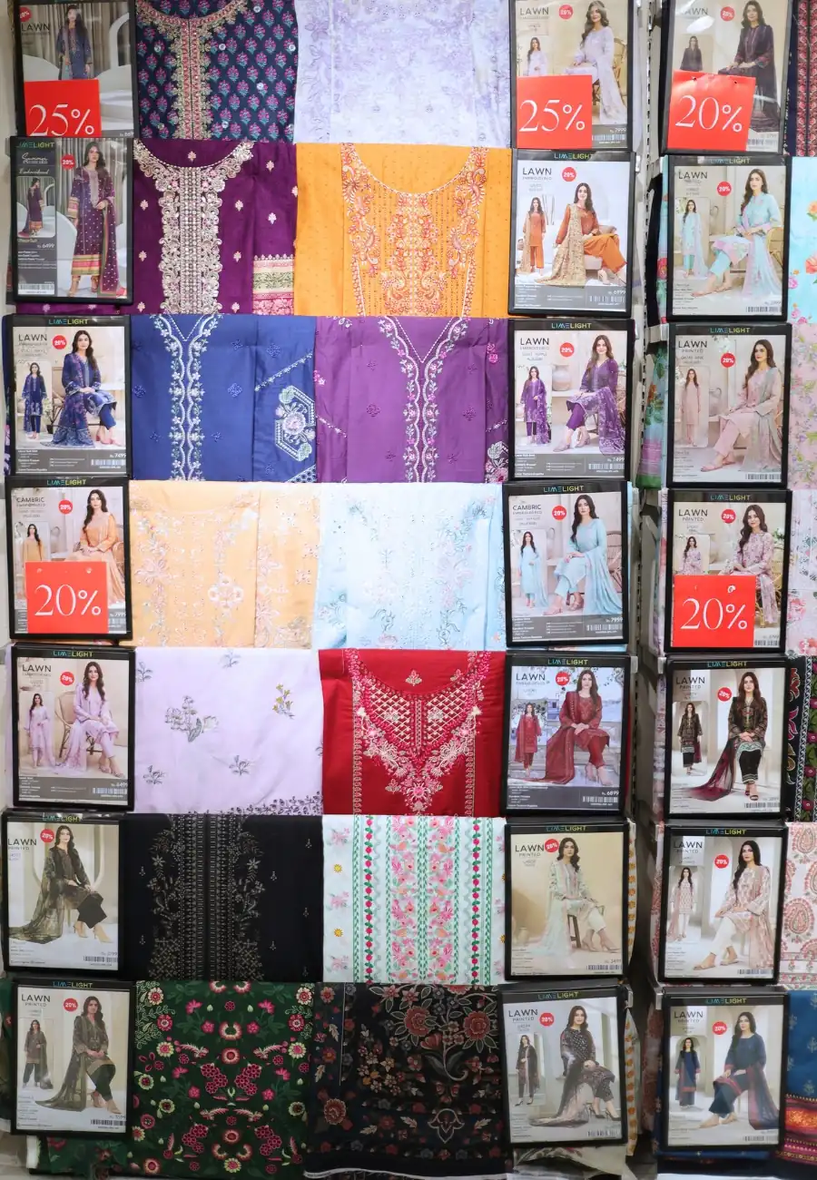 A wall of boxed unstitched suits at Limelight
