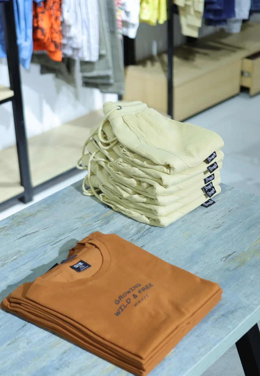 Folded knitwear on a display table at ONE